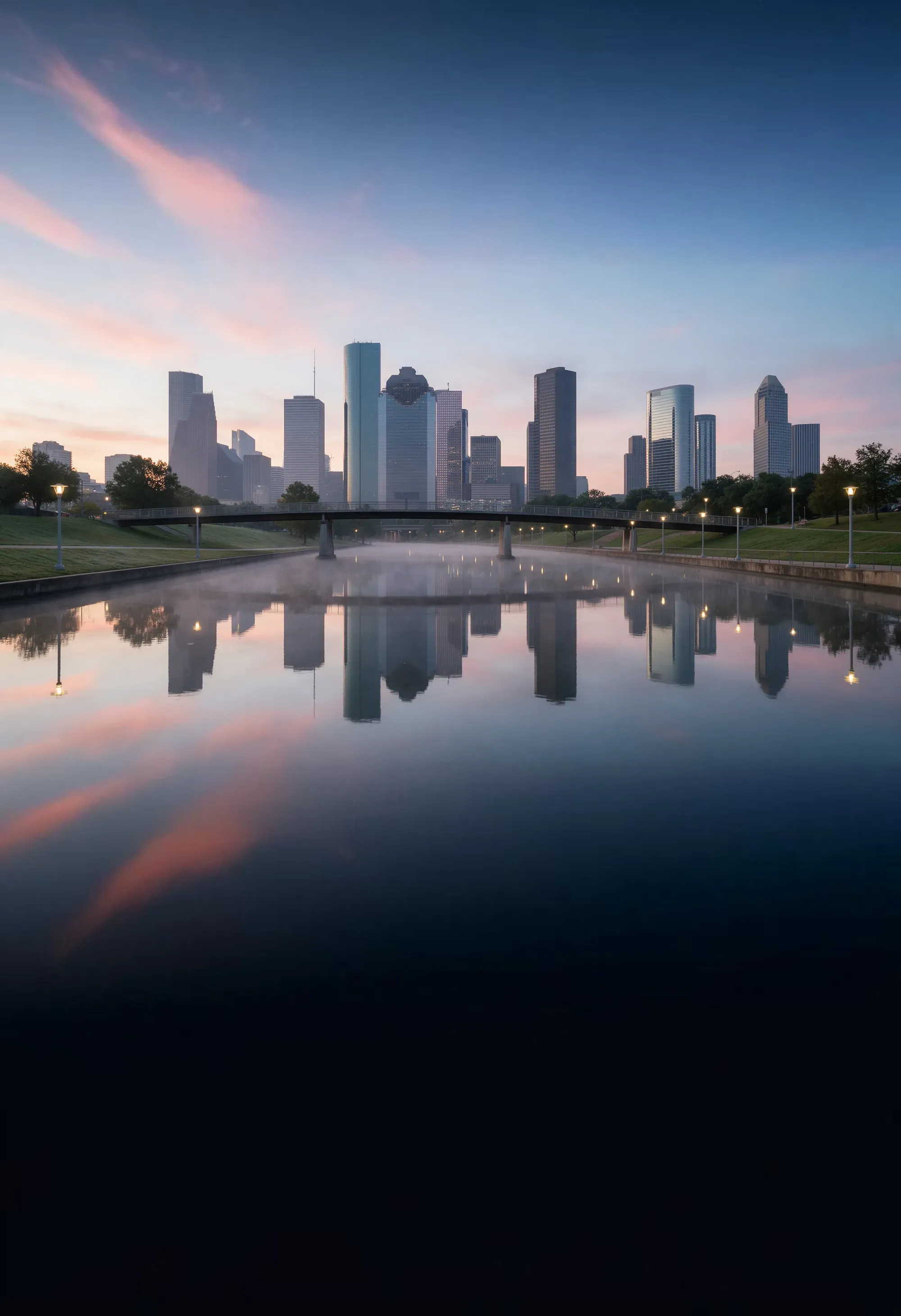 Buffalo Bayou at first light with the downtown Houston skyline reflected in still water